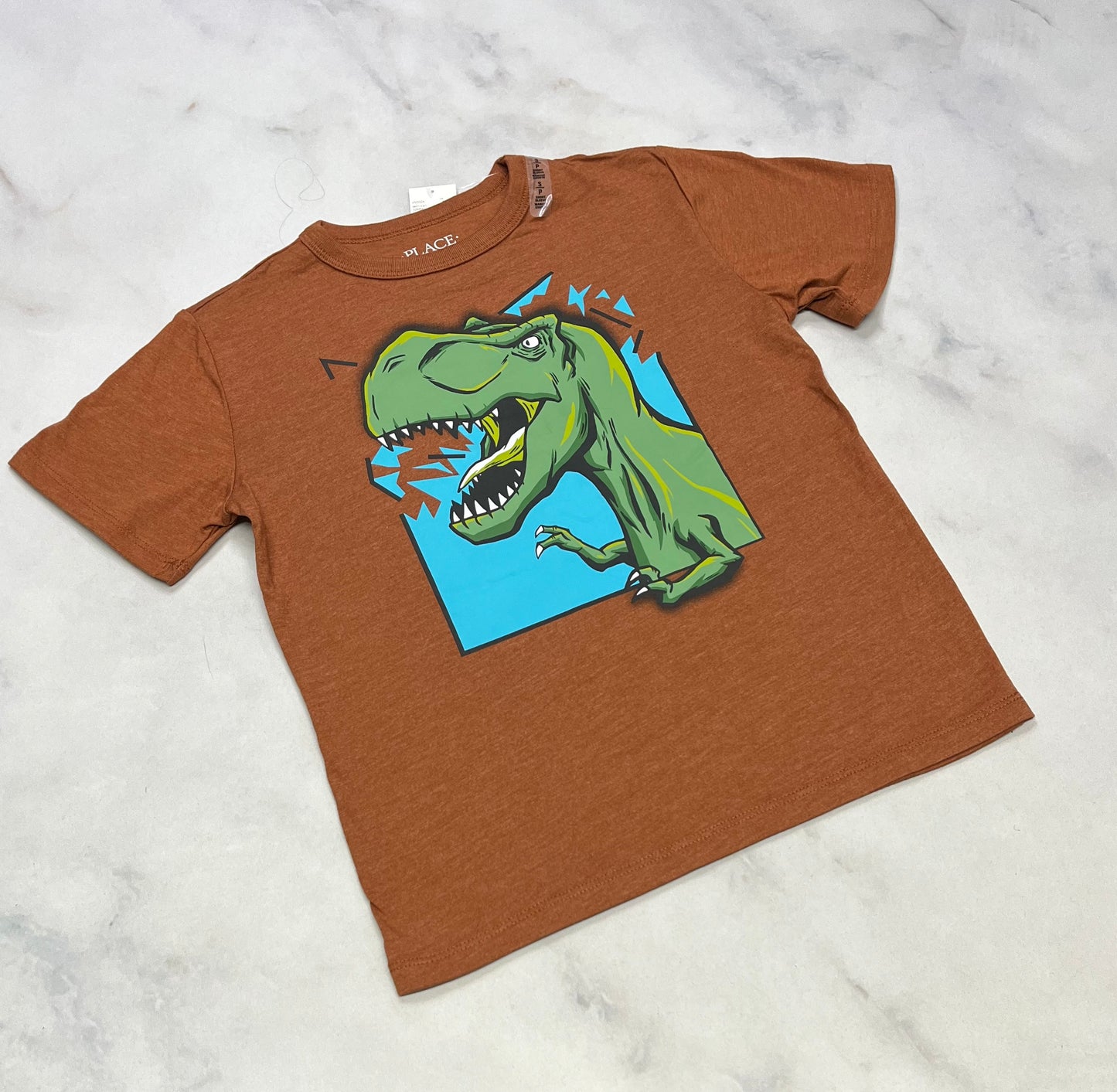 Dino: manche courte neuf 5-6 ans