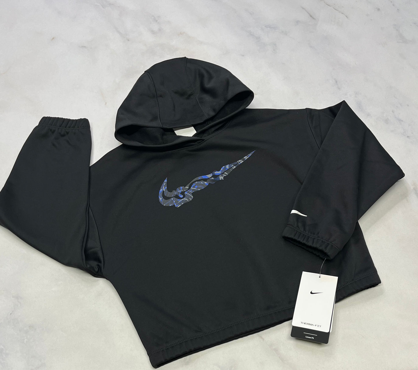 NIKE: Cagoule tissu sport intérieur en polar doux .