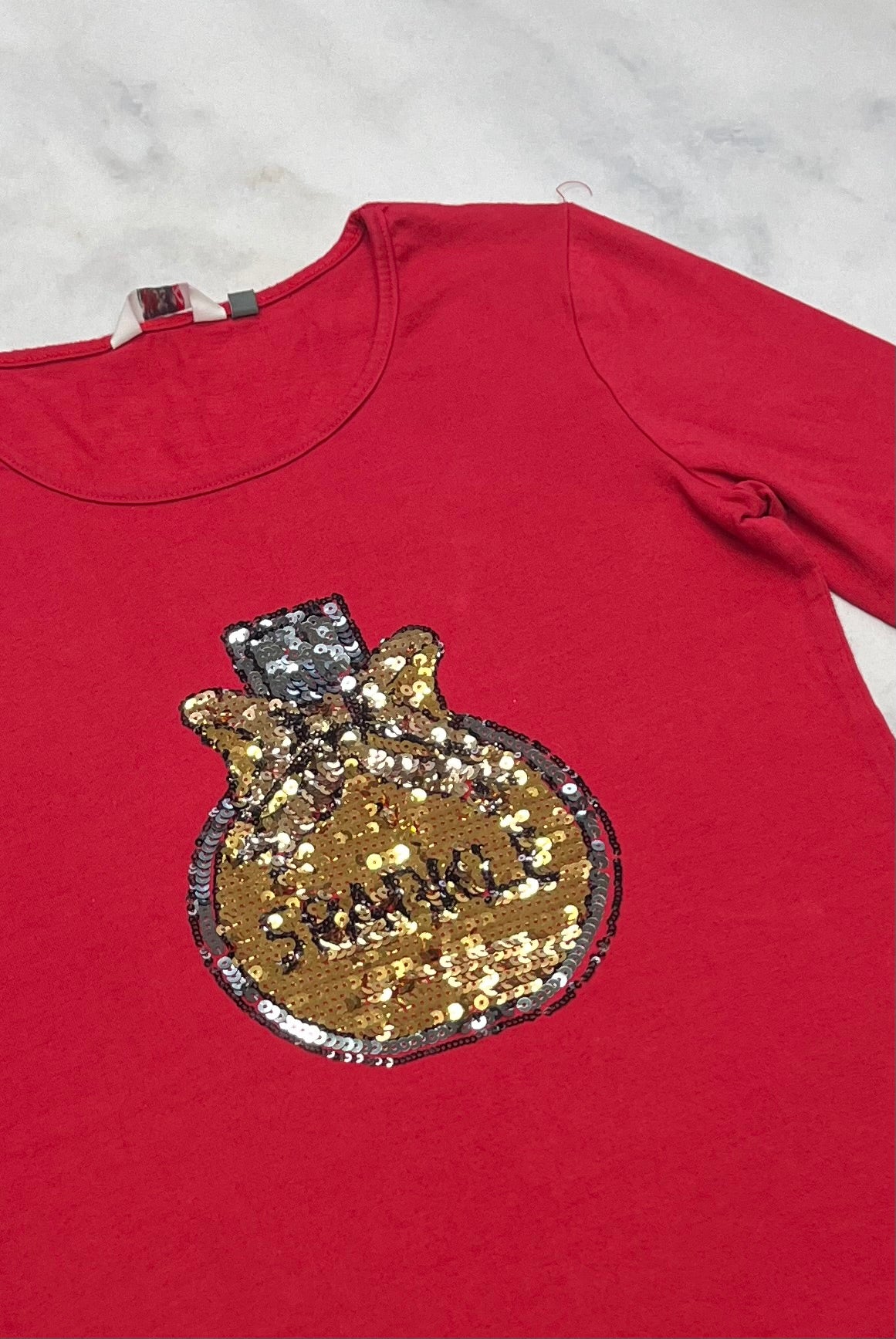 Miss K : manche 3quart fait 7-8 ans bon état .