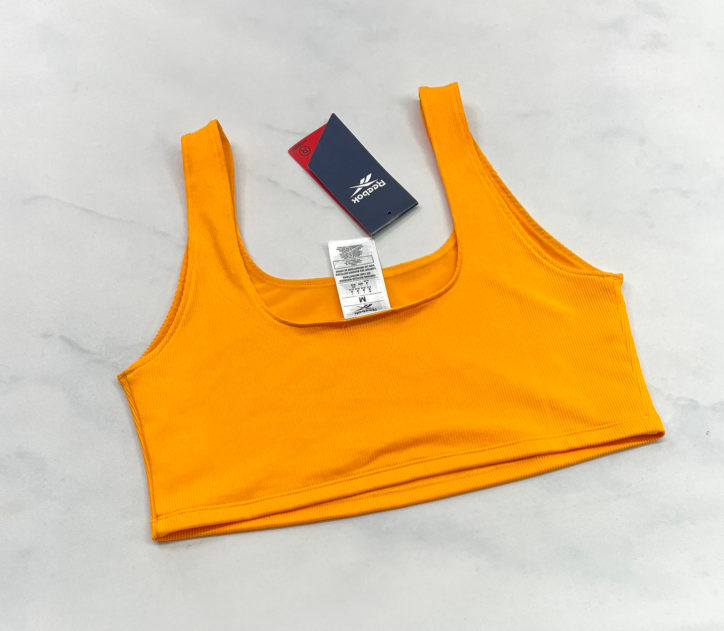 ..Reebok: Top sport M/ femme texturé sans pad. Neuf!