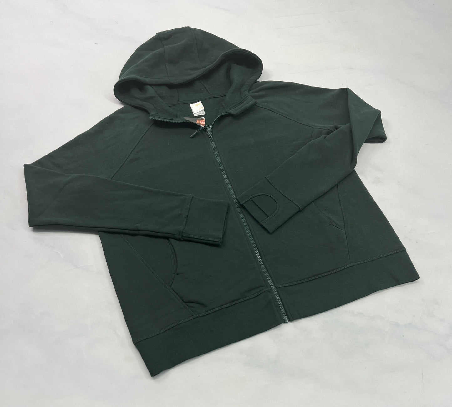 Lolë : Veste verte en ouaté avec trou pour les pouces . Neuve XL( fait L-Xl) 12-14 ans femme .