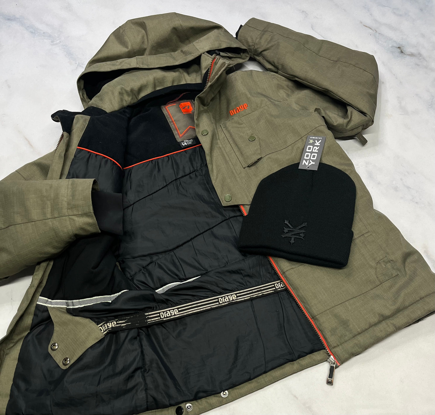 Duo : ORAGE manteau d’hiver kaki chaud / souple poignet ajustable ! Capuchon amovible 14 + (14-16 ans )garcon comme neuf ! + tuque Zoo York neuve .